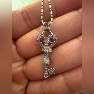 14k key pendant on 18k gold chain